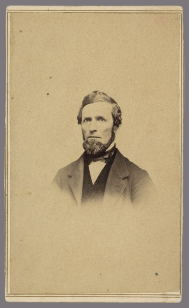 Vignetted carte-de-visite portrait of John Q. Adams, a teacher and Republican politician. He was Member of the Wisconsin State Assembly from the Columbia 2nd district (1853-1854, 1863-1964) and Member of the Wisconsin Senate from the 25th district (1854-1857).