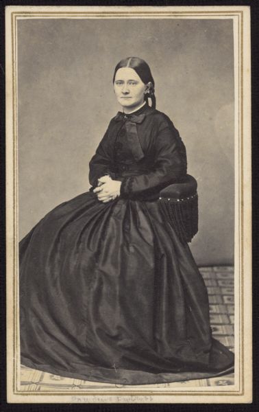Seated carte-de-visite portrait of Catherine Fox Adamson, daughter of Dr. William Fox and wife of Civil War captain Frederick Adamson. She was also the sister of Anna M. Fox Vilas, the wife of William Freeman Vilas.