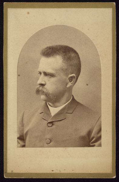 Quarter-length semi-profile carte-de-visite portrait of Walter G. Adams, a mechanic from Sandwich, IL.