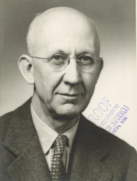 Quarter-length portrait of Homer Adkins, professor of Chemistry at the University of Wisconsin-Madison. Dr. Adkins studied the hydrogenation of organic compounds. He was also involved in wartime research into chemical agents and poisonous gases, and how to protect soldiers from their effects.