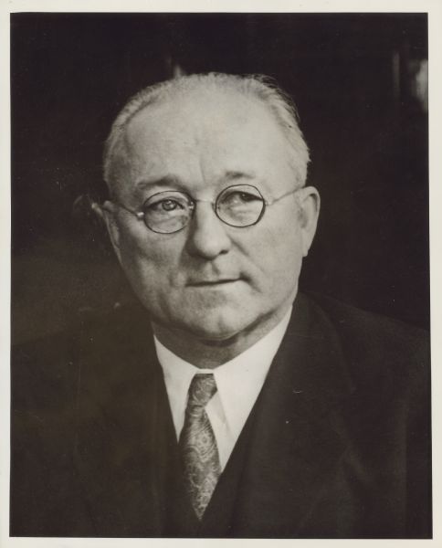 Quarter-length portrait of Henry Ohl, Jr., general organizer/president of the Wisconsin State Federation of Labor, 1917-1940. He was a Socialist member of the Wisconsin State Assembly, representing Milwaukee (1916-1918) and a member of the International Typographical Union.