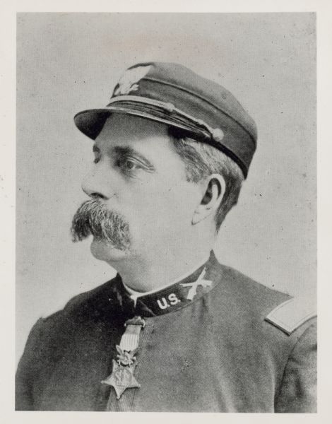 Profile portrait of George E. Albee, a career military officer. He enlisted in Berdan's Sharpshooters (Wisconsin Company G) in 1862, then served in several capacities for different units over the years. He was captain of the 41st U.S. Infantry during the Indian Wars, from which he received the Medal of Honor. After his military career, he helped develop the Hotchkiss rifle for the Winchester Repeating Arms Co. of New Haven, CT.