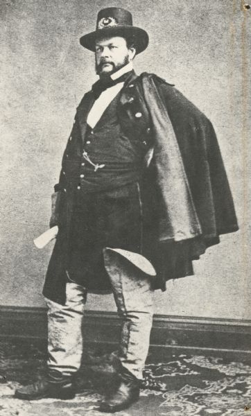 Full-length portrait of Barton Stone Alexander, an architect, engineer, and United States Army officer. He held the rank of Lieutenant colonel in the Union Army during the Civil War, and was made brevet brigadier general in 1866. In 1867, he was ordered to the West Coast to serve as chief U.S. Army engineer for the region. He oversaw numerous projects to improve ports and oceanside communities.