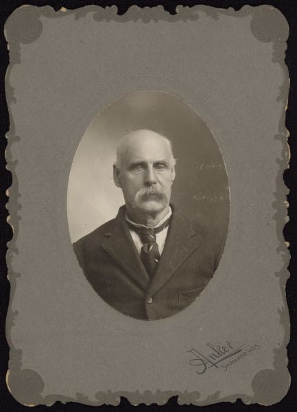 Oval-framed quarter-length portrait of Daniel Allender, of Northport. He was identified in 1909 as the first white boy born in Milwaukee, on April 14, 1838. He served as a teamster in the 1st Wisconsin Cavalry, Company E, during the Civil War.
