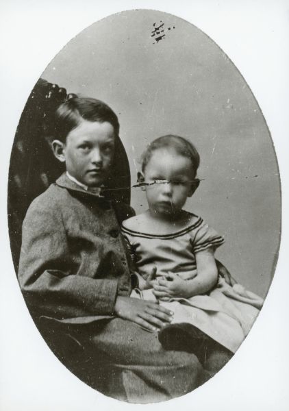 Oval-framed portrait of two children, identified as Willie Gowdy (left) and Edward Alsworth Ross (right). Willie Gowdy was Edward's half-brother.