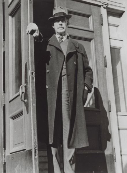 UW-Madison sociology professor Edward Alsworth Ross poses in the doorway of a building.