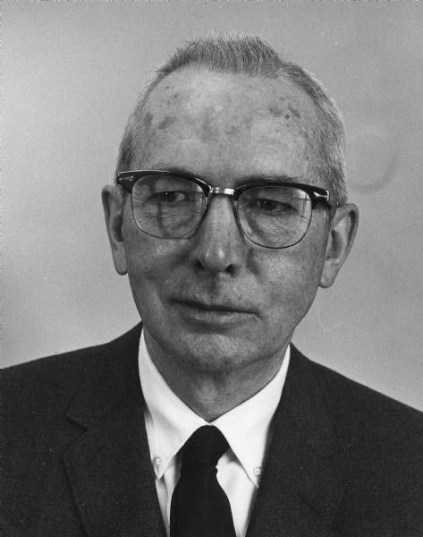 Head and shoulders portrait of Dr. Stephen H. Ambrose, a World War II veteran and physician from Whitewater. He was medical director of Fairhaven Residential Facility and a physician at the University of Wisconsin-Whitewater, where the student health center was named in his honor. He was also a member of the Wisconsin State Board of Regents.