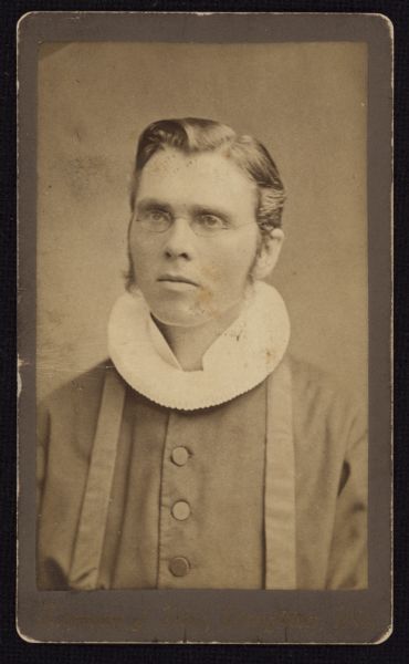 Waist-up carte-de-visite portrait of Reverend Ole Amble, a Norwegian immigrant and Lutheran pastor, taken around the time he was a seminarian at Augsburg Seminarium in Marshall.