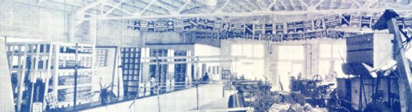 Interior view at Eilert's Farm Equipment Company showing the showroom floor. Eilert's was an International Harvester dealership.