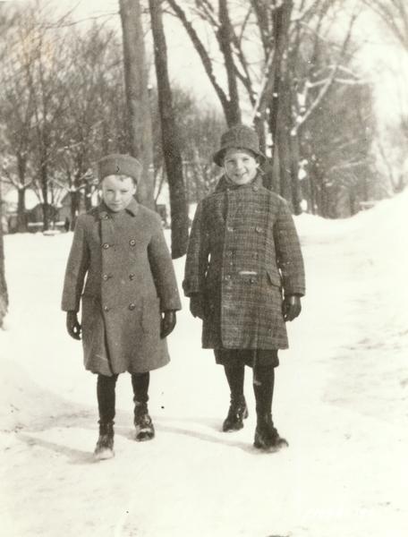 Fred MacMurray, on the right, as a young boy outdoors in winter with his friend Randall McKinstry.