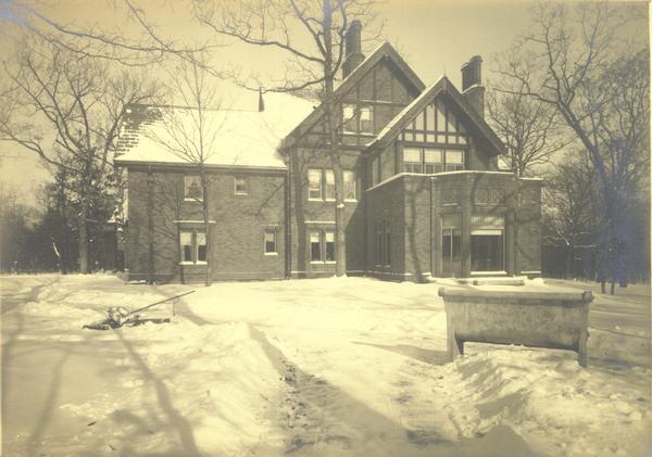 Exterior view of the house in the woods in winter.