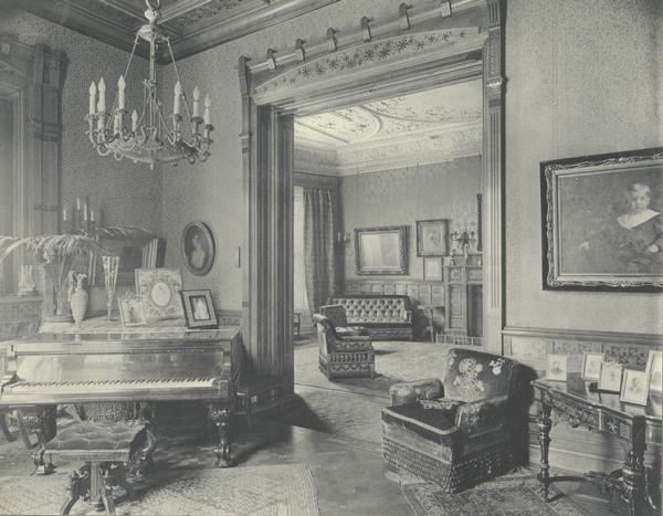 Interior view of the McCormick family residence on Rush Street, showing a piano in the left-hand foreground. The house was built for Cyrus Hall McCormick and his family in 1879. After McCormick's death in 1884, the house was occupied by his widow Nettie Fowler McCormick.