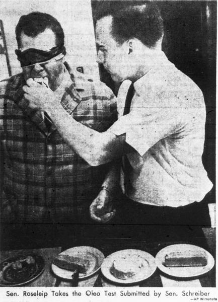 Senator Gorden Roseleip taking the oleo/butter taste test, administered by Senator Martin Schreiber.