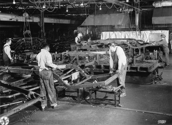 Workers at the A.O. Smith Corporation in Milwaukee assembling frames for Cadillac automobiles. In 1902 Arthur O. Smith, son of the company's founder, produced the first pressed steel automobile frame in the nation. In 1920 the company constructed an automobile frame plant, the only such plant of its kind, which was capable of producing 10,000 auto frames per day.