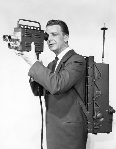 Chet Huntley, manning a portable television unit, for coverage of 1956 political conventions.