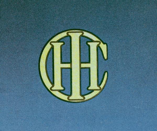 Simple, green International Harvester logo on the back cover of Feed Grinders catalog. This version of the logo was used before 1946.
