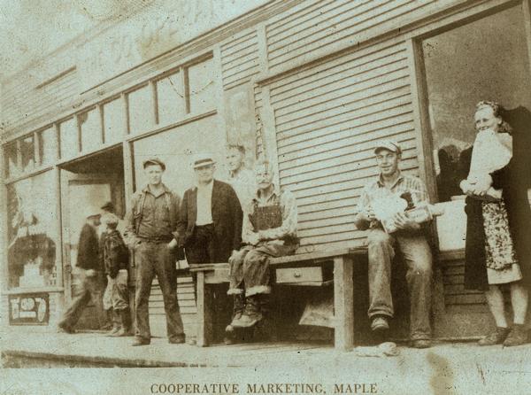 Customers standing in front of the Cooperative Marketing Store.