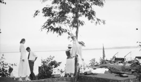 Mary Baldwin (Duluth), John Neimeyer (Duluth), and the bow of the "Zenya."