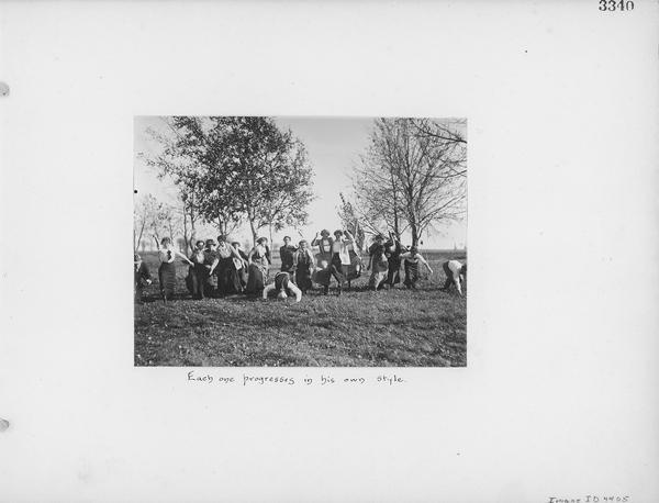 Depicts a group comprised mostly of women posed in a variety of stances as if to begin a race.  The image carries the hand-lettered caption "Each one progresses in his own style."