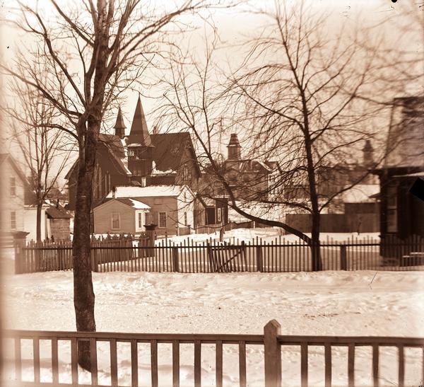 A winter scene showing the courthouse, schoolhouse, and Congregational Church, Sturgeon Bay, Wisconsin.