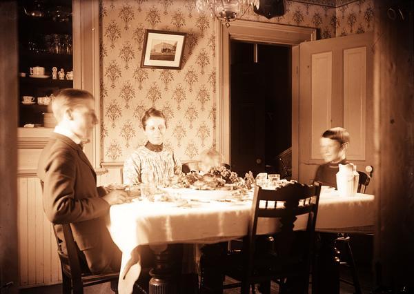 Family gathered at the dining table.