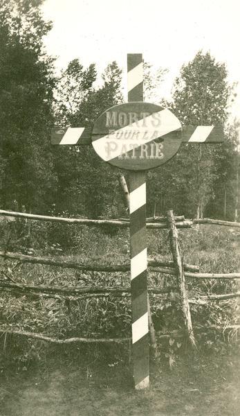 A cross with the inscription "Morts Pour La Patrie." Captioned "Dead for the Country," a familiar sign in the valley of the Marne.