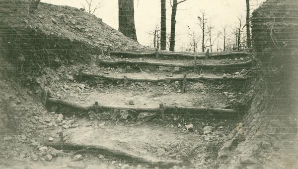 Dirt stairs through the trench wall. Captioned: "Passages up which troops rush for an attack."