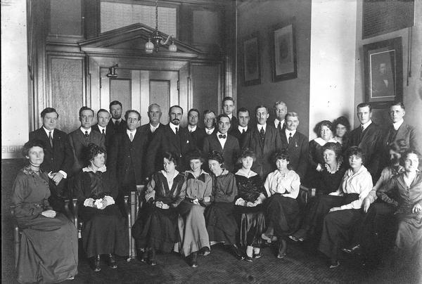 Group portrait of the Secretary of State office staff on the first floor of the west wing of the third Wisconsin State Capitol, the second in Madison.