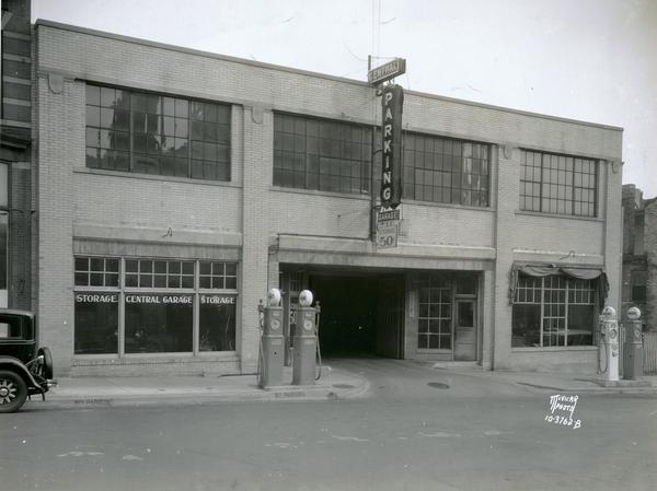 Exterior front view of the Central Parking Garage at 13-15 South Webster Street showing four gas pumps in front. Property owned by George Gill, business operated by the Lappley brothers.