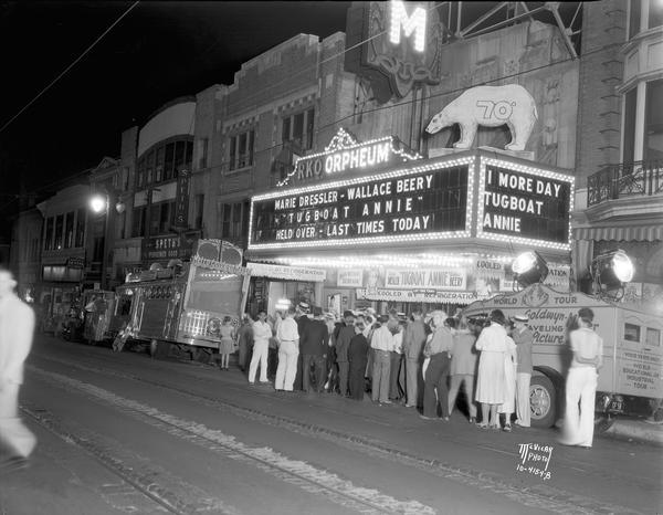 Crowd assembled outside the RKO Orpheum Theatre to watch "Tugboat Annie" on MGM's traveling theatre. Speths Clothing and other businesses in the 200 block of State Street are further down the street.