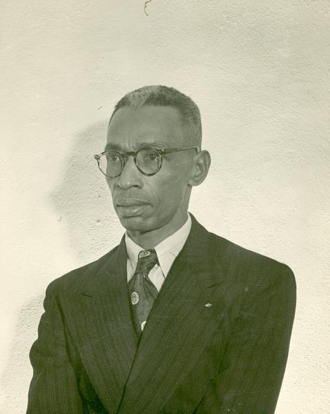 Quarter-length portrait of L.C. Bates, editor and publisher of the the "Arkansas State Press," a crusading Little Rock newspaper and the husband of the Arkansas NAACP leader Daisy Bates.
