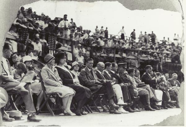 Charles A. Lindbergh (center) surrounded by Wisconsin dignitaries during a ceremony at Camp Randall Stadium that honored him.  Lindbergh was a student at the University of Wisconsin, 1920-1922, and Madison was proud to welcome him during the national tour that followed Lindbergh's trans-Atlantic flight.