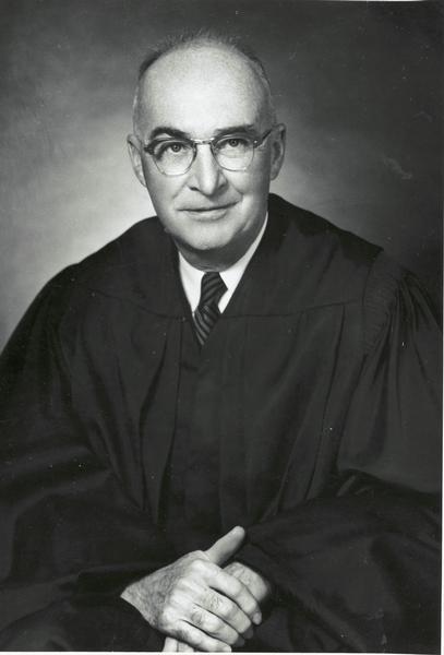 Studio portrait of Chief Justice George R. Currie wearing his black robe.