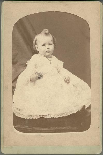 Portrait of Louis de Vierville Dousman as an infant wearing a formal white baby dress.  Son of Louis and Nina Dousman.  Born February 17, 1882; died August 11, 1955.