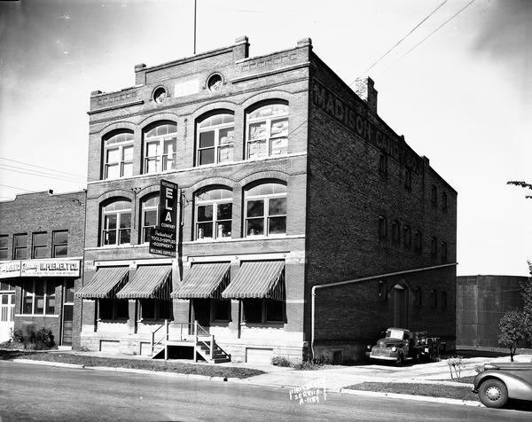 Richard Ela Company, 744 Williamson Street, selling industrial and welding equipment and supplies and Hanley Implement Company, 740 Williamson Street, selling Allis Chalmers tractors and farm implements. Formerly the Madison Candy Company building, built in 1903.
