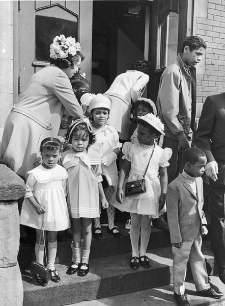 Children walking out of church after the Easter Sunday service at St. James United Methodist Church at 1114 West Brown Street.