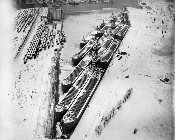 Overhead view of ships tied up for the winter in slips.
