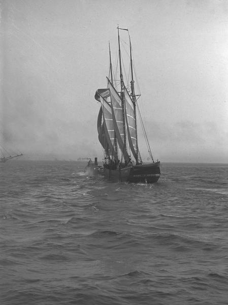 View of a ship called "The Ruby" going out from the mouth of a harbor.