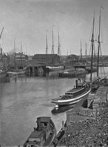 View down the river toward the Bay from Walker's Point Bridge, showing several steamboats.