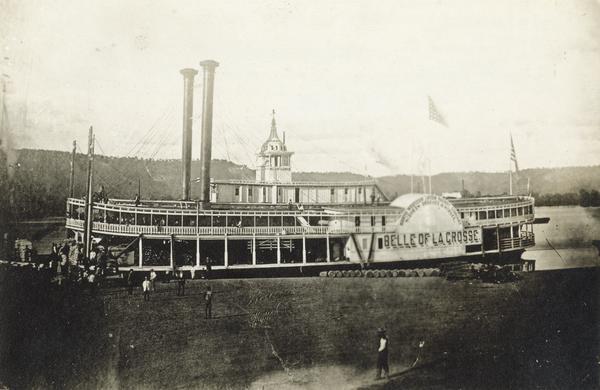 The sidewheel packet, <i>Belle of La Crosse</i>, at a landing on the Upper Mississippi River. The sidewheel was built in 1868 and burned while in winter quarters at Alton Slough in 1881-1882.