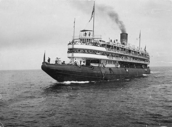 The screw passenger excursion vessel, "Christopher Columbus" underway on the Great Lakes. Decks are filled with passengers. The "Christopher Columbus" was the largest excursion steamer of its time, 362 ft. in length, with a capacity of 4000 passengers.