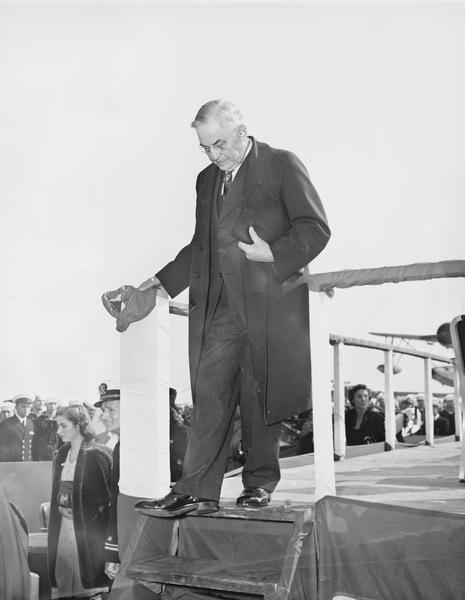 Justice Marvin B. Rosenberry leaving the stand after delivering the address presenting the Wisconsin Silver Service aboard the USS "Wisconsin".
