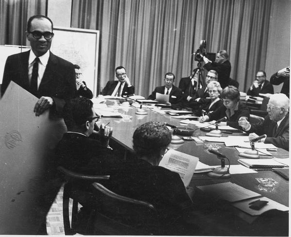 Lloyd Barbee, NAACP state president, walking out of a Milwaukee Public School Board meeting when Chairman Harold W. Story refused to allow the participation of other education representatives of civil rights groups.