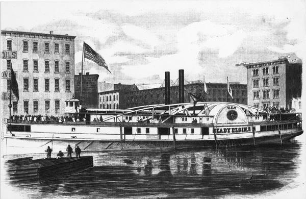 Lithograph from <i>Frank Leslie's Illustrated News</i> of the sidewheel passenger, <i>Lady Elgin</i>, at her wharf in Chicago, Illinois in 1860. From a photograph taken on the day prior to her sinking. Sign on her side reads U.S.M., Chicago, Milwaukee, Lake Superior Line, Lady Elgin.