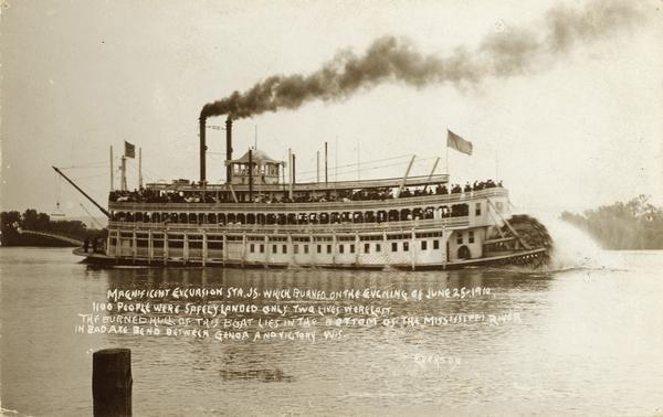 The sternwheel excursion, <i>J.S.</i>, underway, taken between 1901 and 1910.  The magnificent Excursion Str. <i>J.S.</i> burned on the evening of June 25, 1910. 1100 people were safely landed. Only two lives were lost. The burned hull of the boat lies in the bottom of the Mississippi River in the Bad Axe Bend bewteen Genoa and Victory, Wisconsin.
