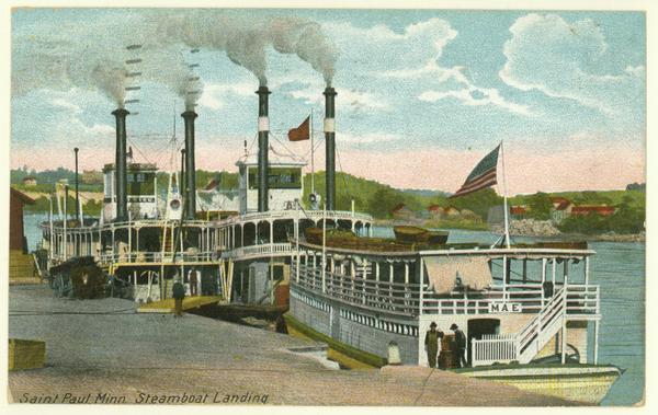 The sternwheel excursion, <i>Red Wing</i>, with the excursion barge, <i>Mae</i>, at a landing. Caption reads: "Saint Paul, Minn. Steamboat Landing."