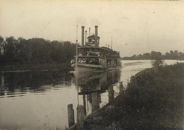 The sternwheel excursion, <i>Thistle</i>, carrying an excursion party on the Fox River.  The fare from Berlin to Oshkosh, a distance of about 25 miles was ten cents.