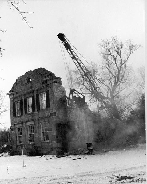 Historic home on University Avenue being demolished. The home was replaced by Burger King, a fast-food, drive-in restaurant.