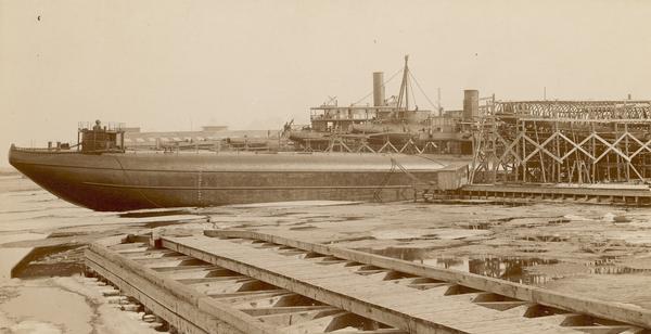 Text at bottom reads: Ship Yards — McDougall Whaleback. West Superior, Wis." Captain Alex McDougall's whaleback steamer in the shipyard of the American Steel Barge Company.