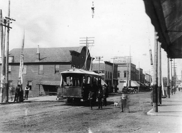 An early electric-powered streetcar in downtown Eau Claire, as it appeared about 1890-1895.